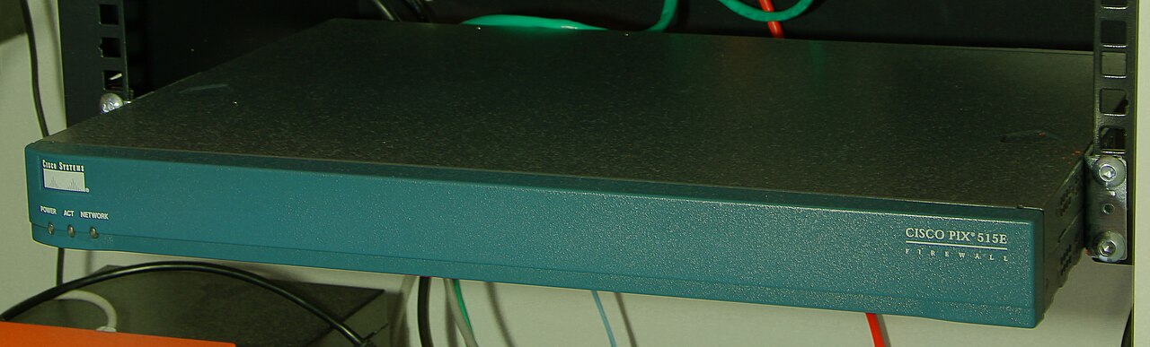 Rackmounted enterprise firewall appliance sitting beside the rest of the network infrastructure it protects