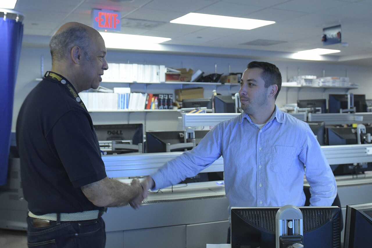 Cybersecurity operations centre where analysts triage exploited vulnerabilities and track remediation deadlines