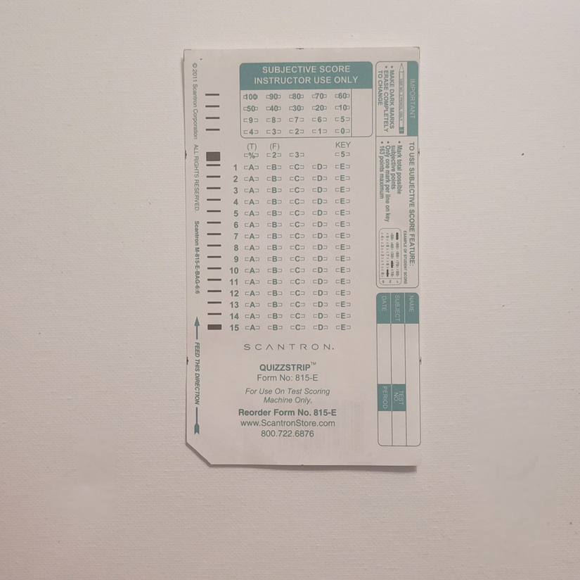 A Scantron 815 E bubble answer sheet used for machine grading of multiple choice tests